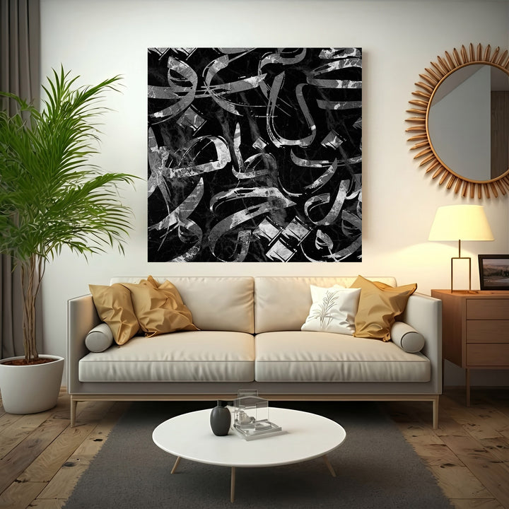 Wadi Home abstract calligraphy wall art with black and silver brushstrokes on a marble background.