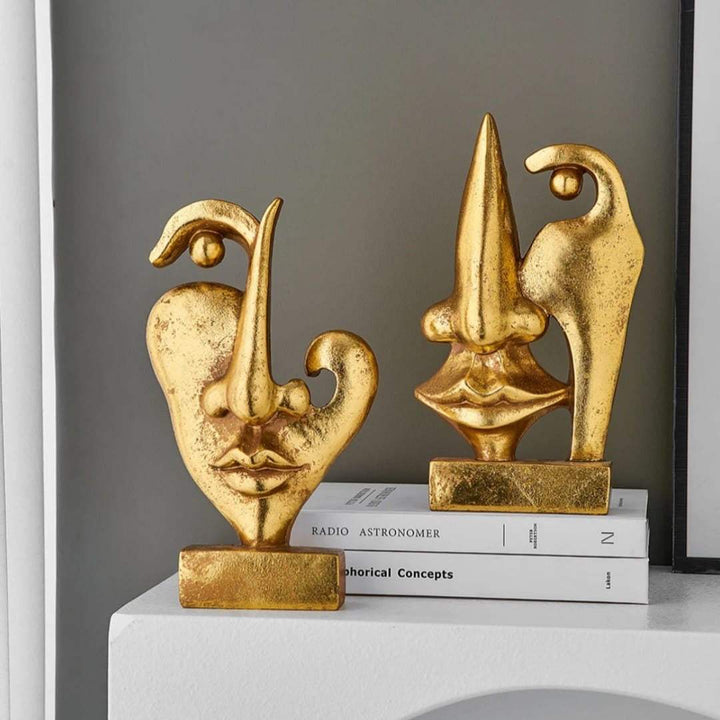 Abstract Gold Face Sculptures