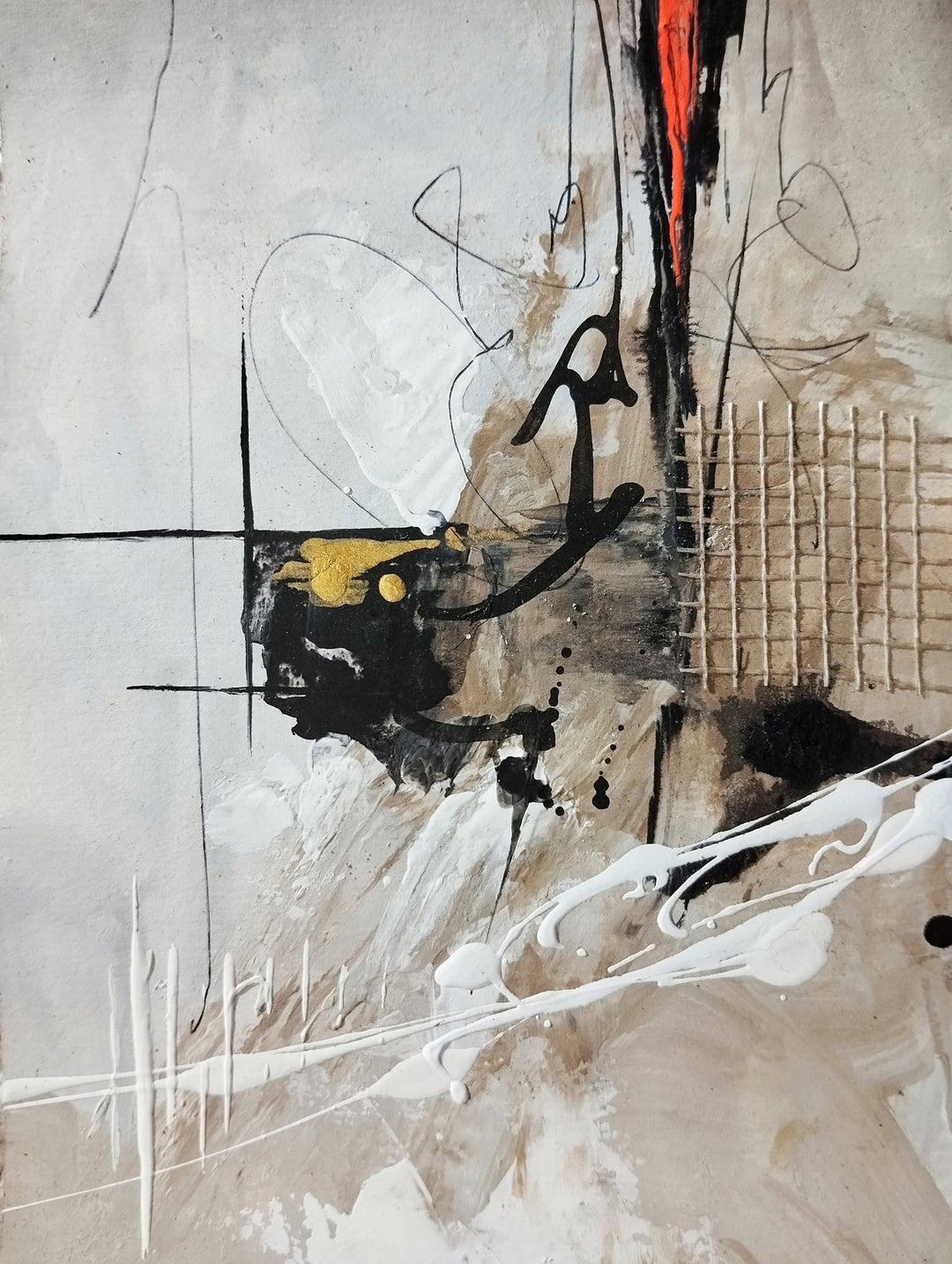 Wadi Home abstract expressionist framed wall art with neutral tones, black, gold, and red accents above a modern sofa.