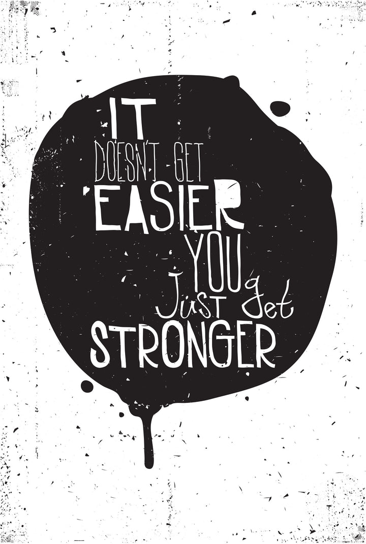 Wadi Home inspirational quote wall art print with black ink-blot design on white background in a modern living room.