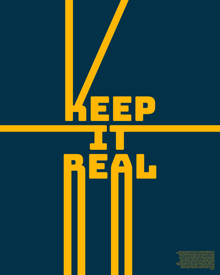 Wadi Home Keep It Real typography poster with yellow text on a navy blue background displayed in a modern living room.