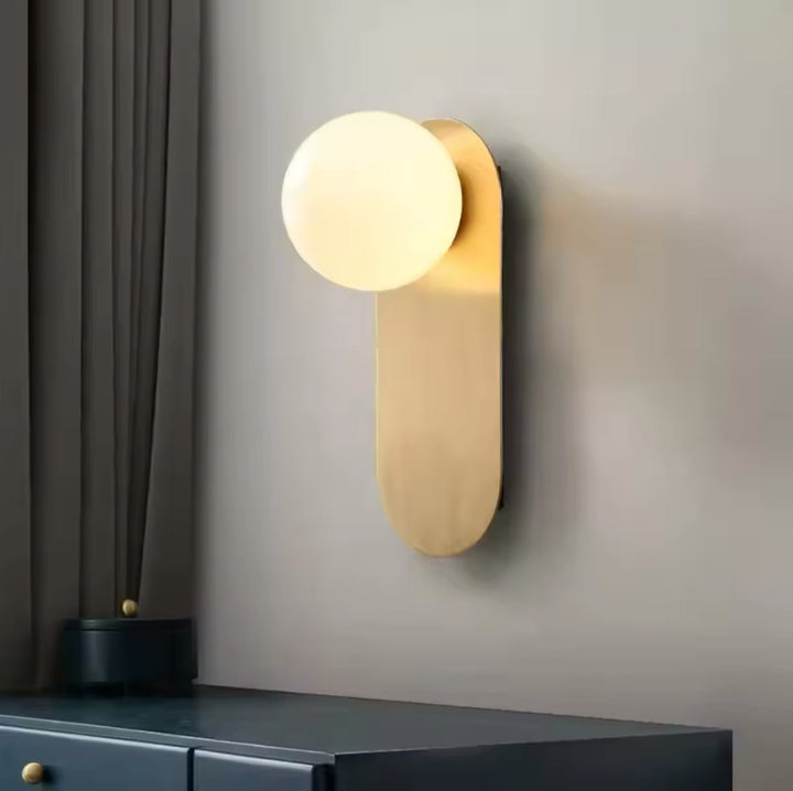 Modern Minimalist Wall Light with Soft Gold Base and Globe Shade