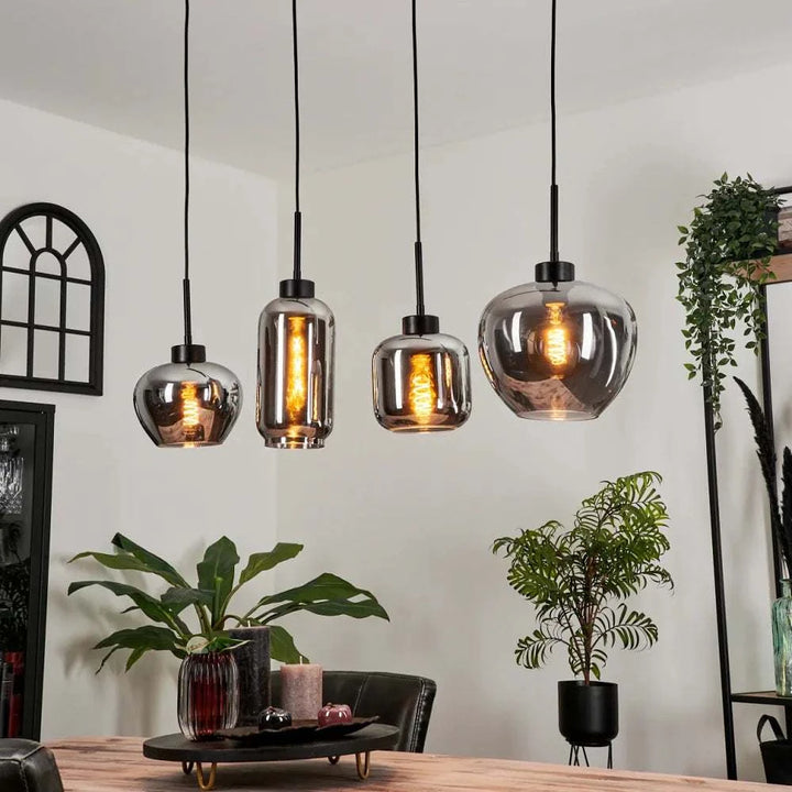 Modern Smoke Glass Pendant LightModern Smoke Glass Pendant Light Cluster with Mixed ShapesThis modern pendant light cluster features a unique arrangement of smoke glass shades in various shapes, each with an exposed filament bulb for a warm, ambient glow.Pendant LightingWadi Home