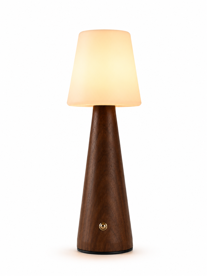 Modern table lamp with walnut wood base and cream fabric shade.