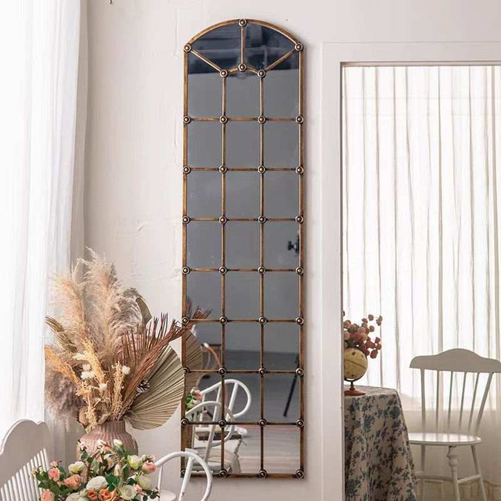 Vintage BronzeVintage Bronze Arched Windowpane Wall MirrorThis vintage-inspired wall mirror features a striking arched windowpane design with a bronze finish. Its classic look adds a touch of elegance and depth to any spaceImported Framed MirrorWadi Home