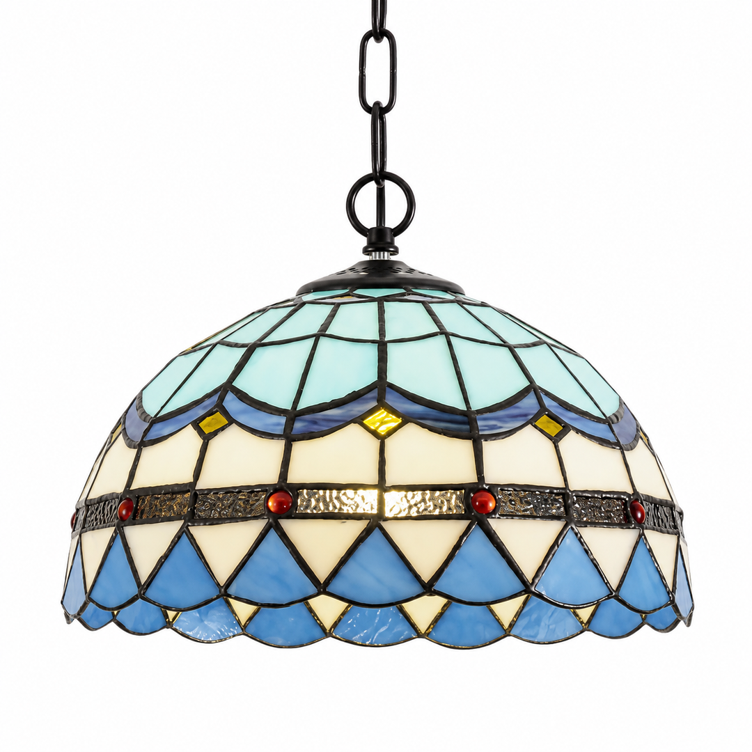 Vintage Tiffany style pendant light with a blue and ivory stained glass dome shade, geometric patterns, and decorative red accents.