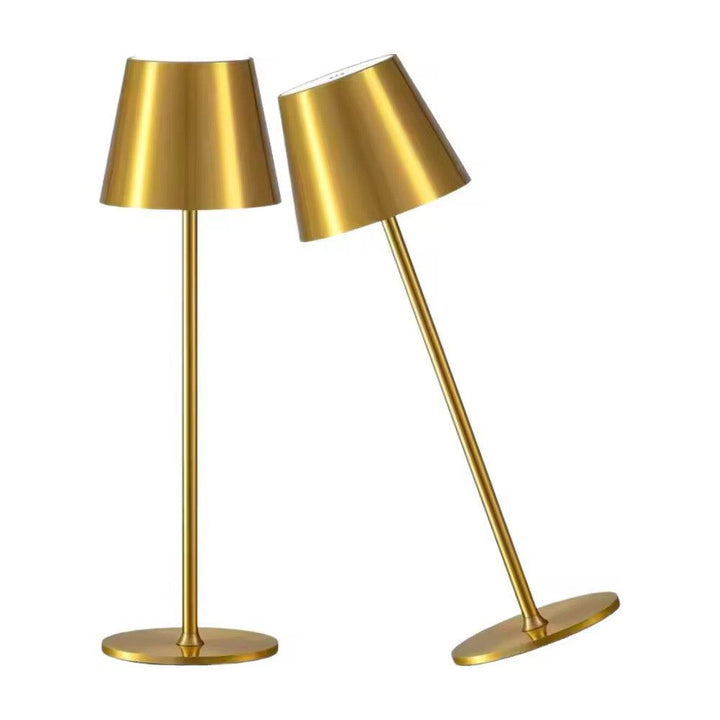 Rechargeable brass color cordless table lamp with sleek cylindrical shade