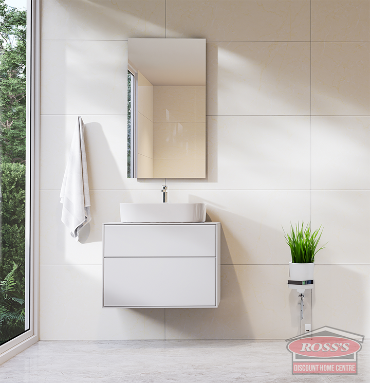 Modern frameless bathroom mirror above a floating vanity