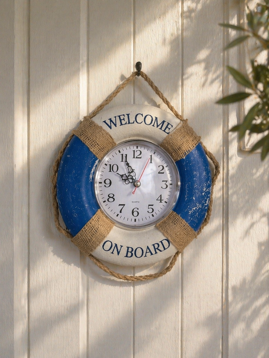 Nautical lifebuoy wall clock with rope accents for coastal decor