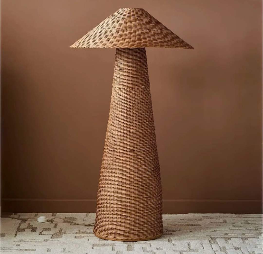 Natural brown woven rattan floor lamp with a tall tapered body and wide conical shade