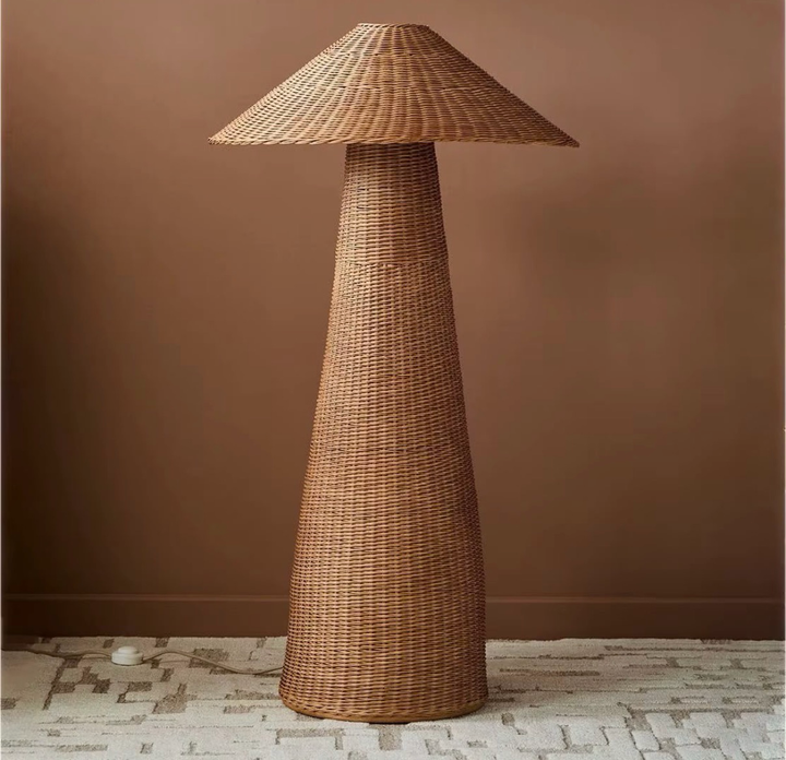 Natural brown woven rattan floor lamp with a tall tapered body and wide conical shade
