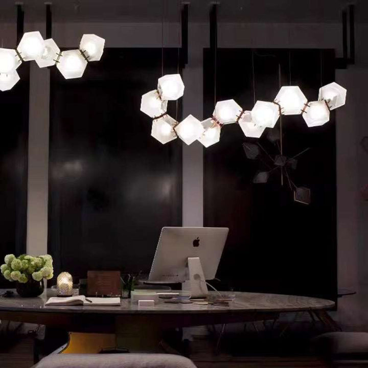 Modern Geometric Pendant LightModern Geometric Pendant Light for Dining Room (8 cells)Illuminate your dining area with this striking modern geometric pendant light, featuring a unique configuration of frosted hexagonal glass shades. Designed to add elPendant LightingWadi Home