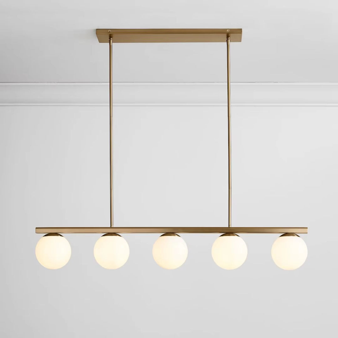 Modern brass five-light globe pendant with five round glass shades