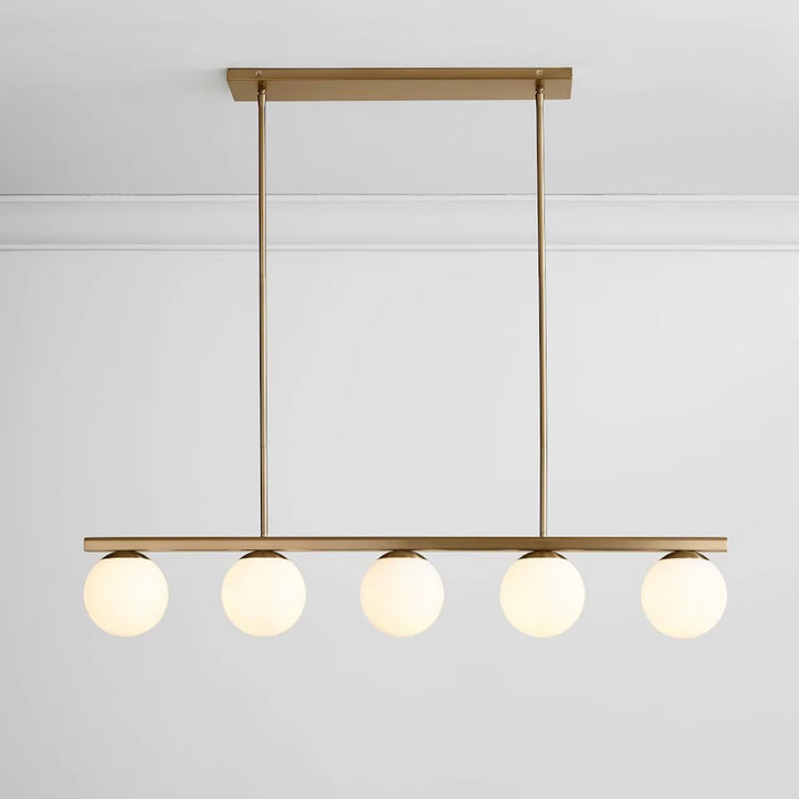 Modern brass five-light globe pendant with five round glass shades