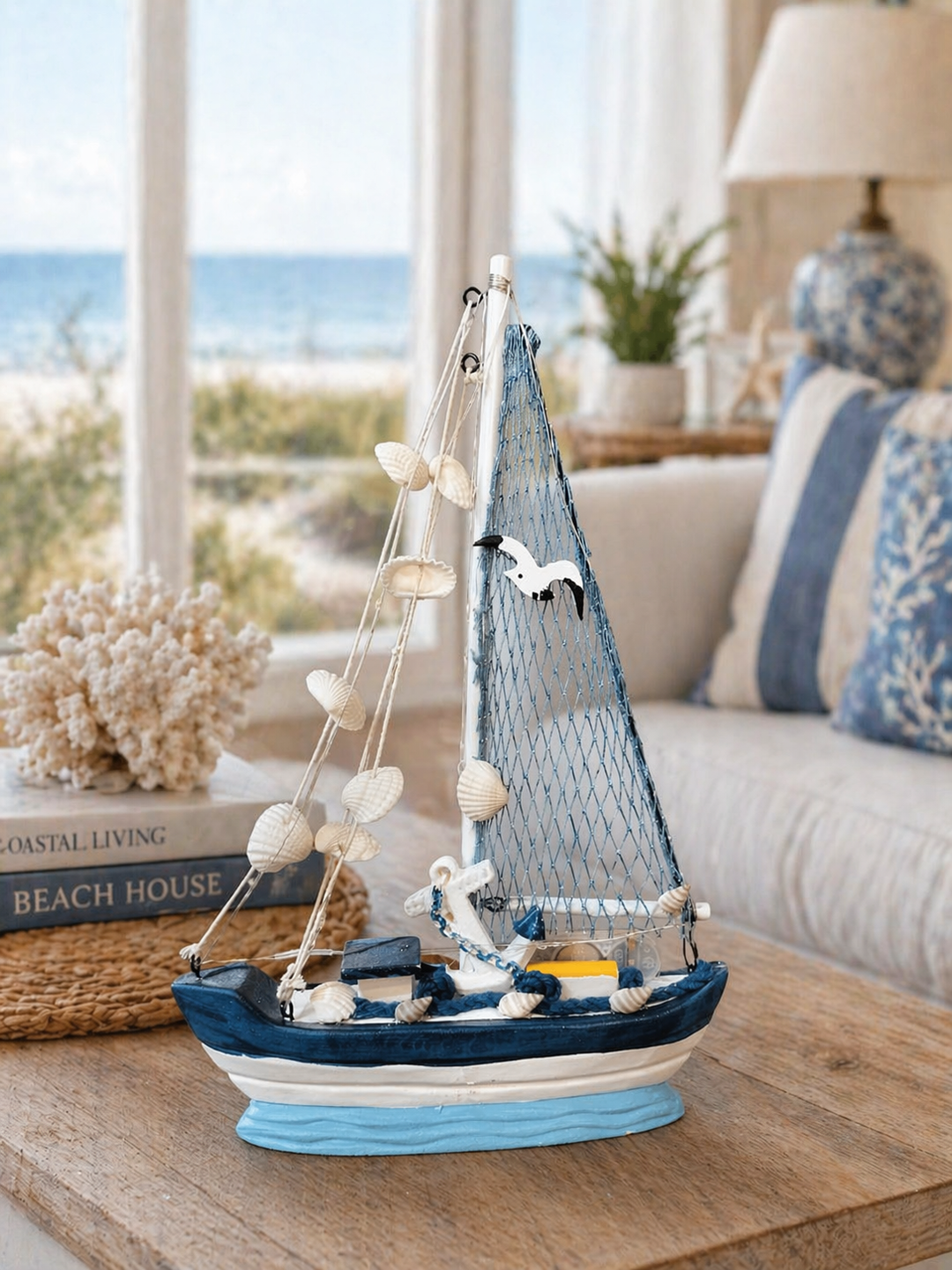 Nautical sailboat decor with white and navy design and ship wheel emblem for coastal home interiors