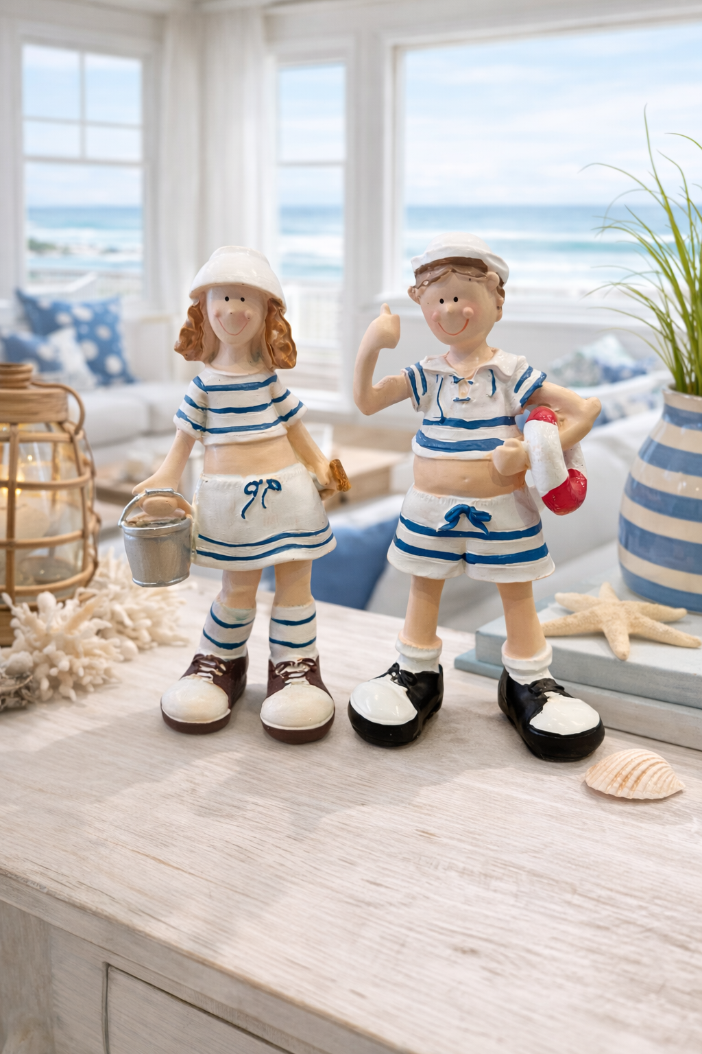 Set of 2 beach kids figurines with soft colors and cheerful expressions for seaside décor