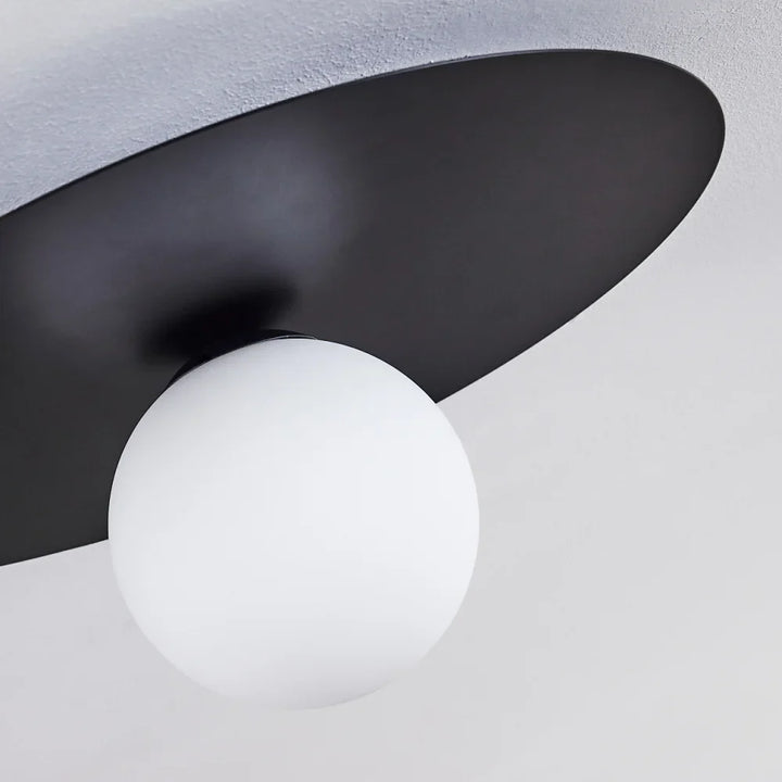 Modern Globe Ceiling Light with Black Disc Design