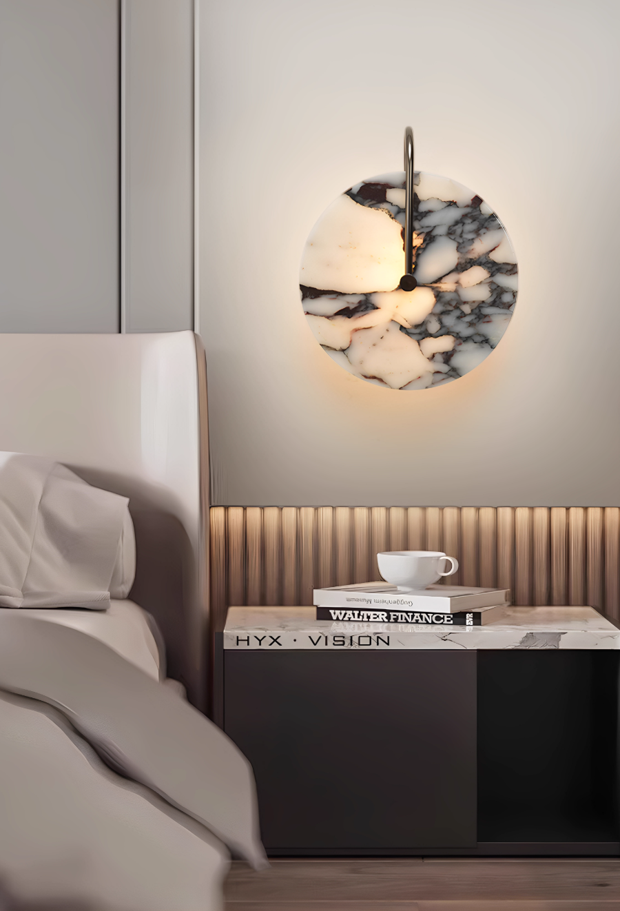 Round marble-effect wall light with dark veining and brass-tone detail, glowing beside a bed