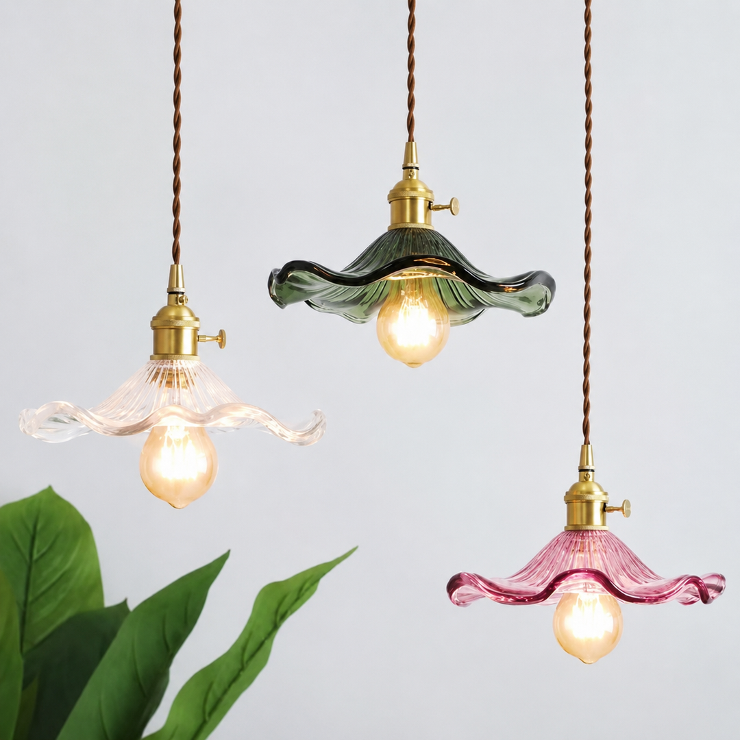 Colorful ripple glass pendant light with brass fitting and exposed warm bulb