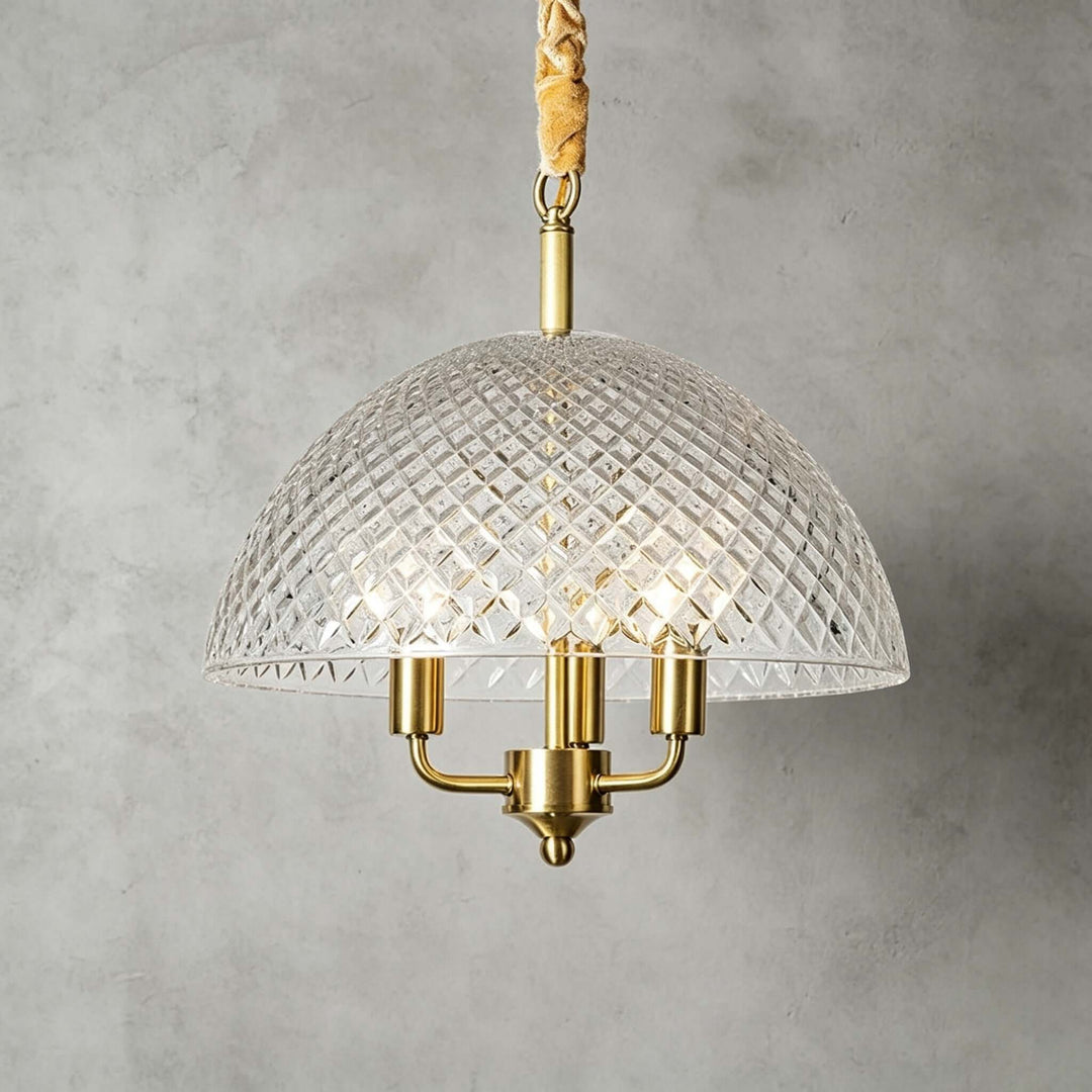 Textured glass and brass pendant light with a diamond-patterned dome shade