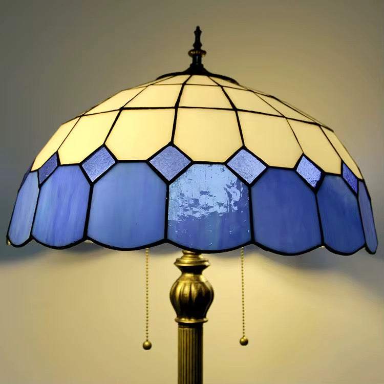 Blue Tiffany floor lamp with classic blue and cream stained glass shade and traditional design