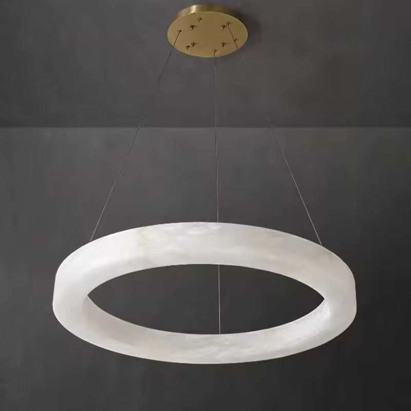 Eclipse Marble Ring chandelier with translucent marble and soft ambient light suspended in modern luxury interior