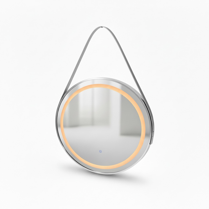 Round mirror with a metallic frame and hanging strap on a white background