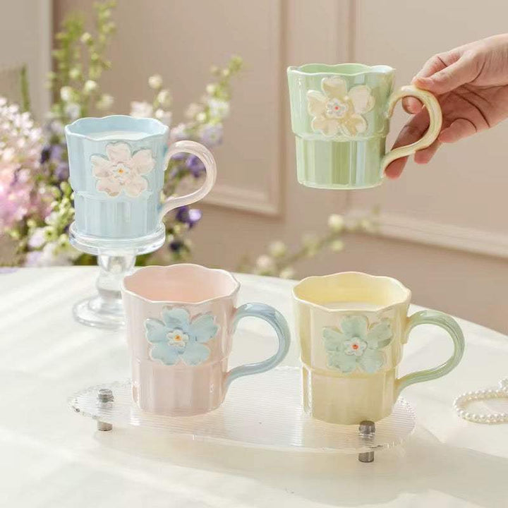 Set of 2 pastel floral ceramic mugs with scalloped rims and raised flower design