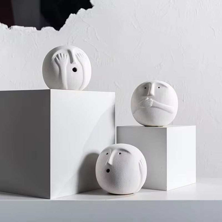 Minimalist white face spherical sculptures set of 3 with abstract carvings for modern decor