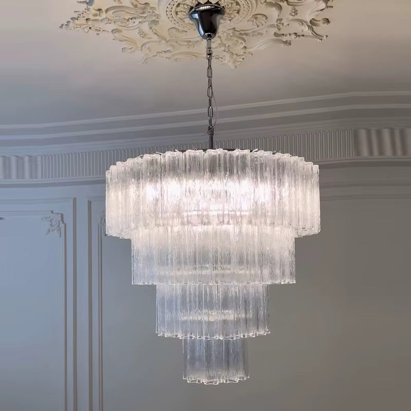 White crystal tiered chandelier with cascading glass layers and modern hanging design