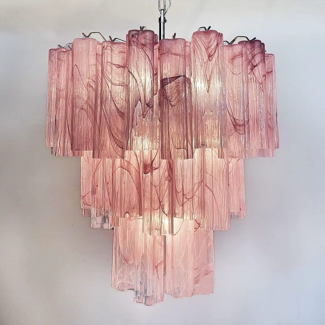 Blush pink glass tiered chandelier with cascading textured glass panels and warm decorative lighting