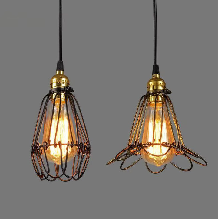 Industrial black wire cage pendant light with exposed Edison bulb and brass fitting