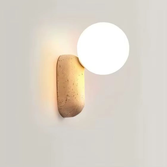 Modern aged brass wall sconce with round opal globe shade