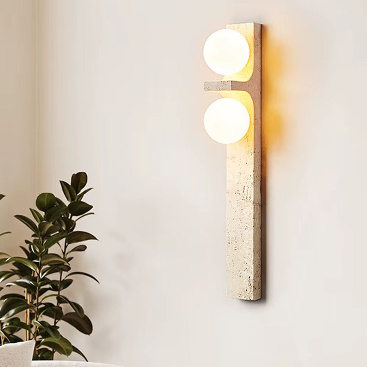 Modern beige stone two-light wall sconce with round globe shades