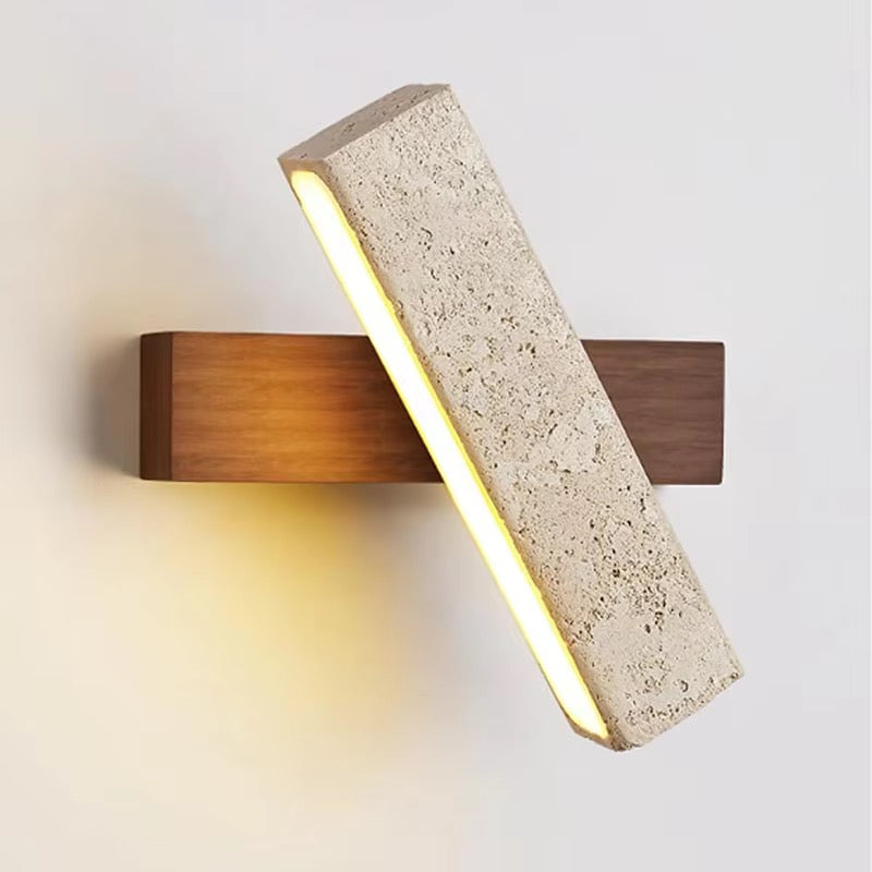 Modern beige stone LED wall sconce with wood backplate and angled light