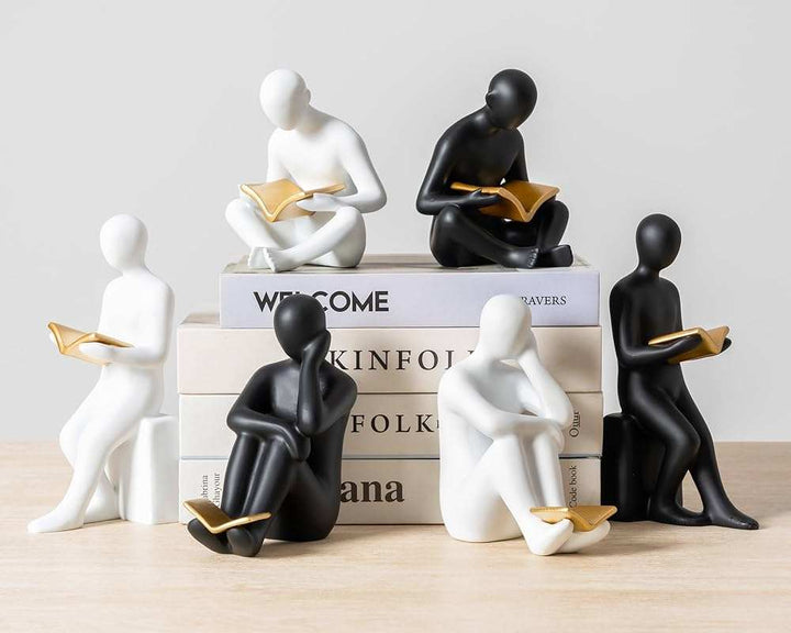 Modern abstract thinking man sculpture set of 2 with matte black finish and gold accent