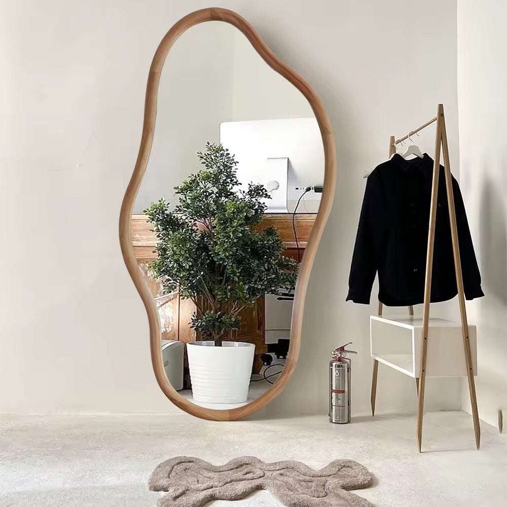 Organic wooden standing mirror with asymmetrical frame for minimalist interiors