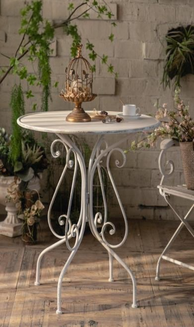 wrought iron garden tableWrought Iron Garden TableBring vintage romance to your patio or indoor space with this wrought iron garden table. Featuring an elegant scrollwork base and distressed white finish, it’s perfeTablesWadi Home