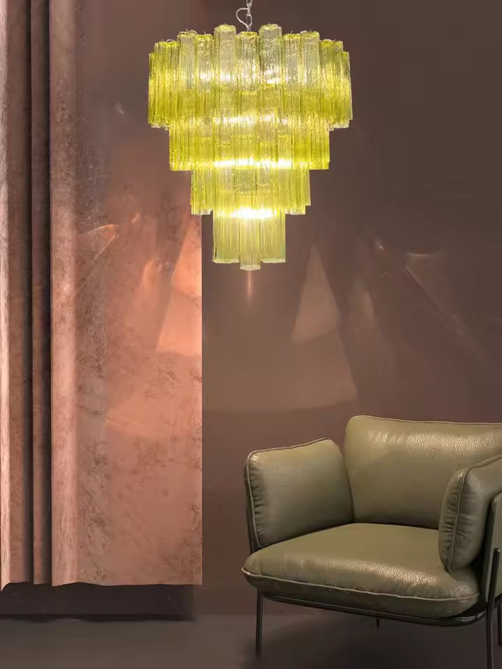 Lime green tiered glass chandelier with cascading ribbed glass tubes in a sophisticated living room