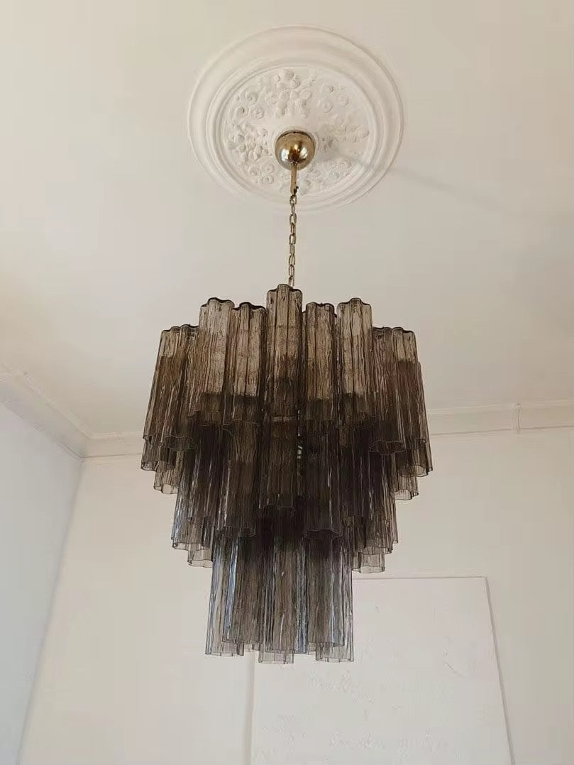 Vintage smoked glass fringe chandelier with cascading layered panels suspended from a chain ceiling mount
