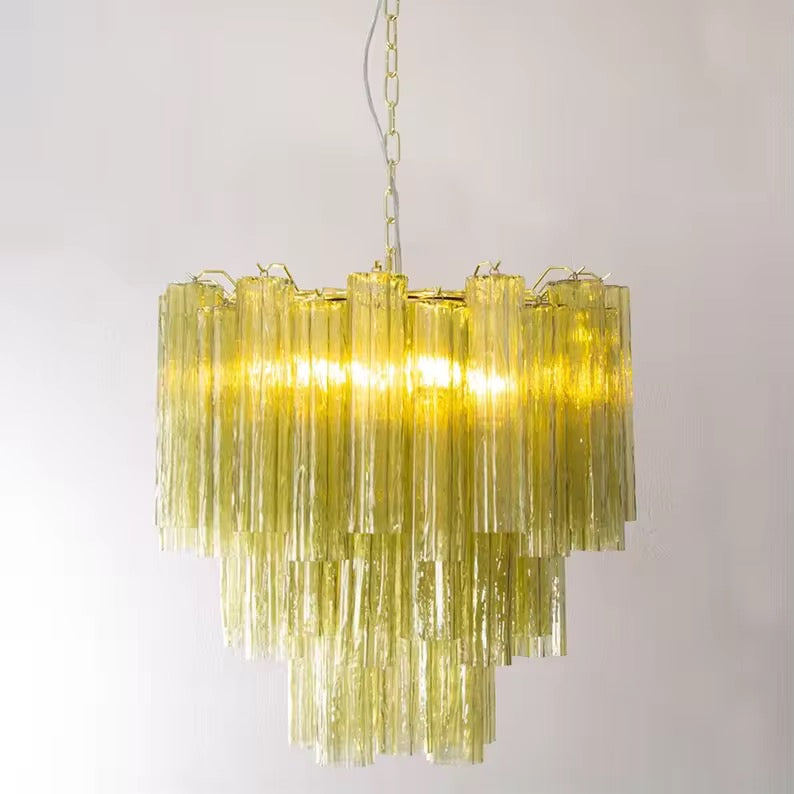 Modern tiered glass chandelier with cascading amber transparent tubes and warm illuminated design