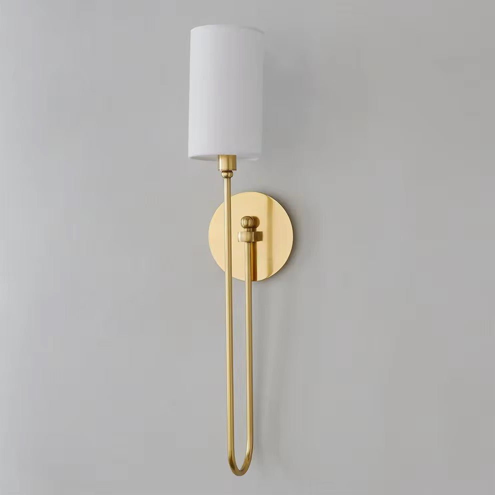 Modern brass wall sconce with white fabric shade and slim vertical gold frame