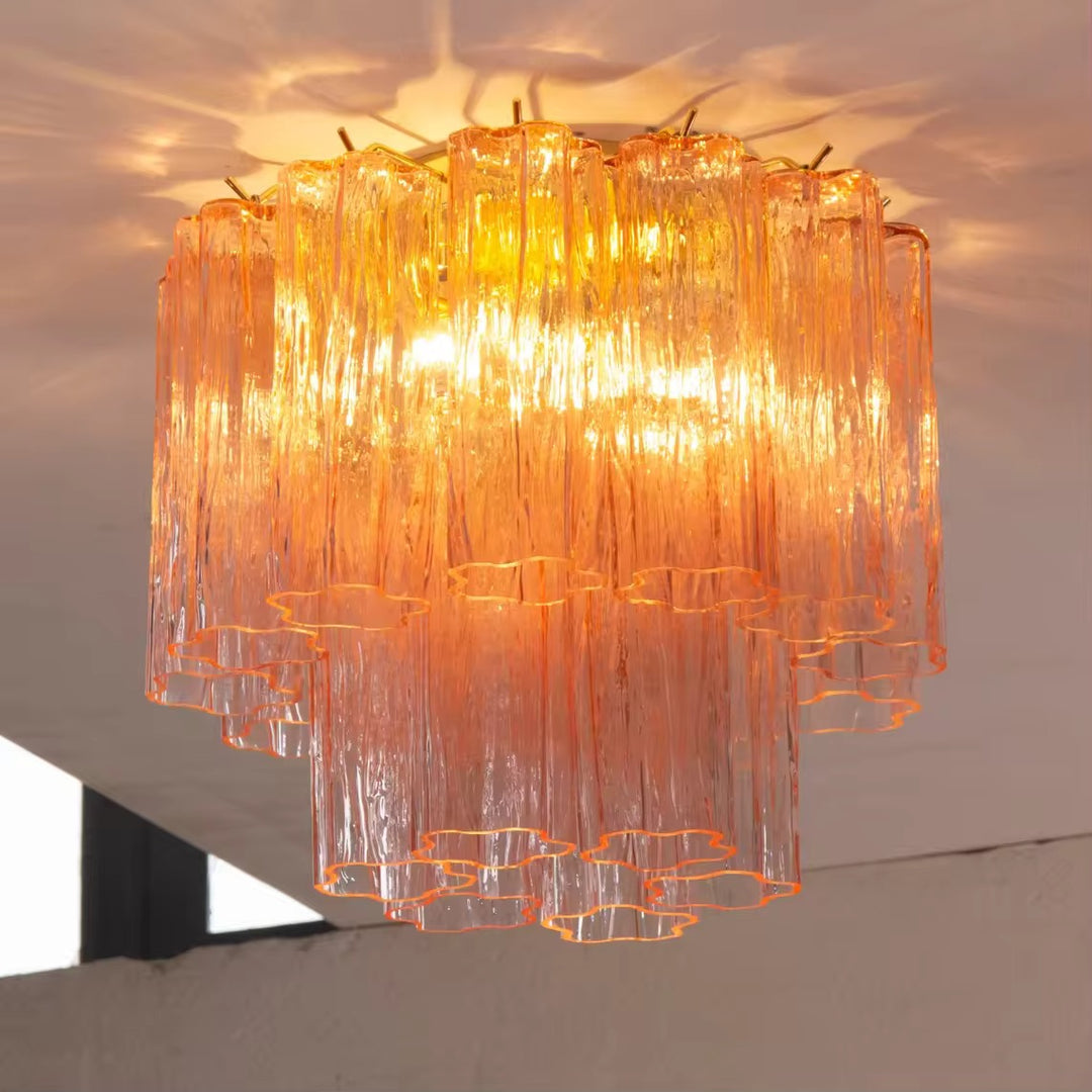 Orange textured glass tiered chandelier with cascading vertical glass shades