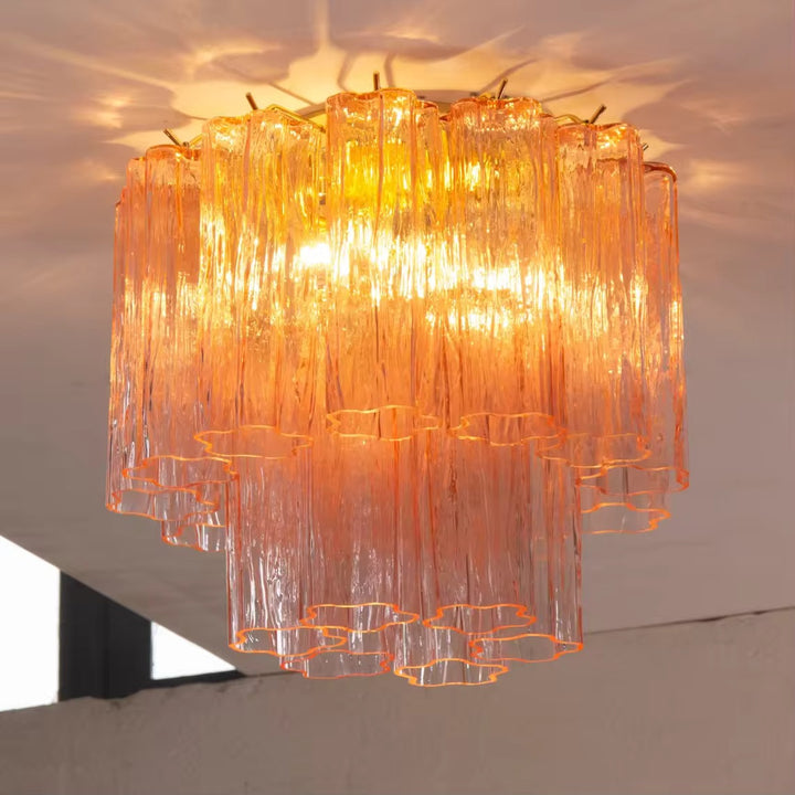 Orange textured glass tiered chandelier with cascading vertical glass shades