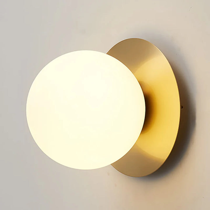 Modern Brass Wall Light with Circular Globe Shade