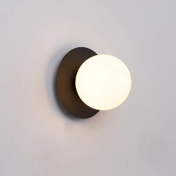 Modern Brass Wall Light with Circular Globe Shade