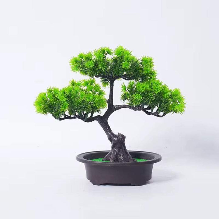 Realistic artificial bonsai tree in shallow pot for decor