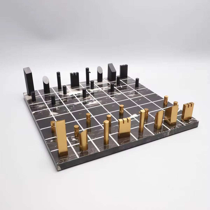Luxury chess board set with black marble and gold metal pieces