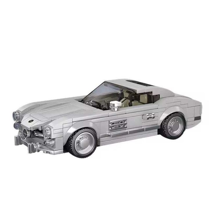 Silver sports car model with sleek curves and detailed design