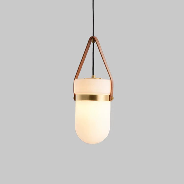 Modern pendant light with rounded opal glass shade, brown leather suspension straps, and brass accent band